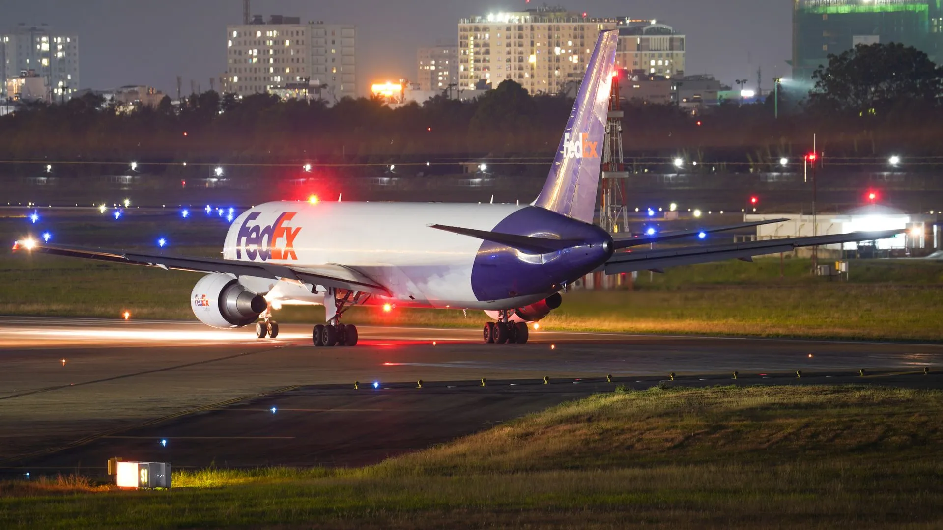 Cargo aircraft on the runway at night